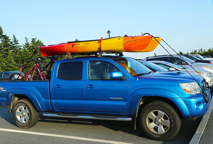 how far can a kayak hang out of a truck featured
